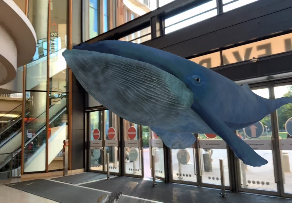 Ein Wal schwimmt in einer Augmented-Reality-Story durch ein Einkaufszentrum